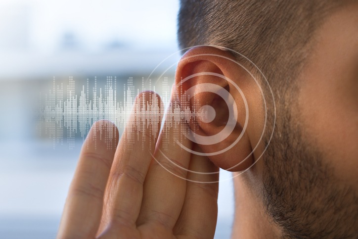 A photo of a young man with hearing problems or hearing loss.