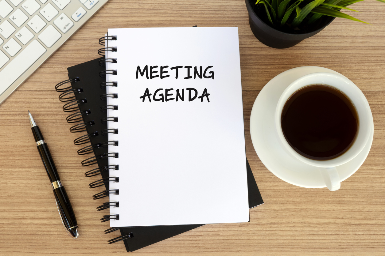 Button to Board meeting agendas consisting of a photo of Meeting agenda text on note pad 