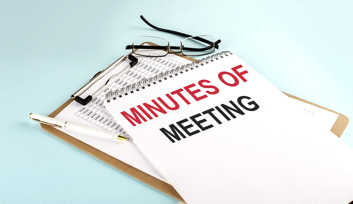 Button to Board meeting minutes consisting of a photo of MINUTES OF THE MEETING text on a notepad on clipboard with chart on blue background