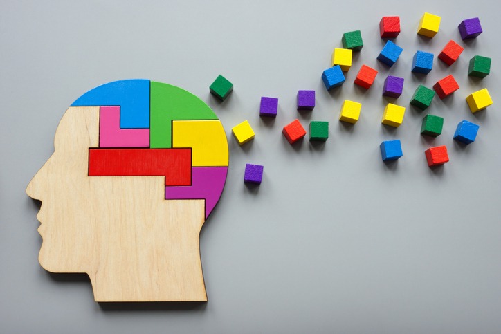 Wooden head made of colored puzzles.