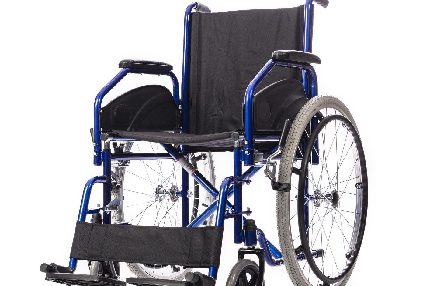 Close-Up Of Wheelchair Against White Background