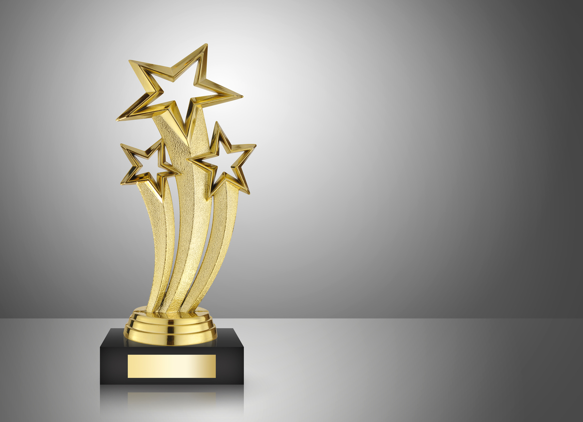 Button for more information on MCHD's awards and recognition consisting of a photo of a golden star trophy on gray background