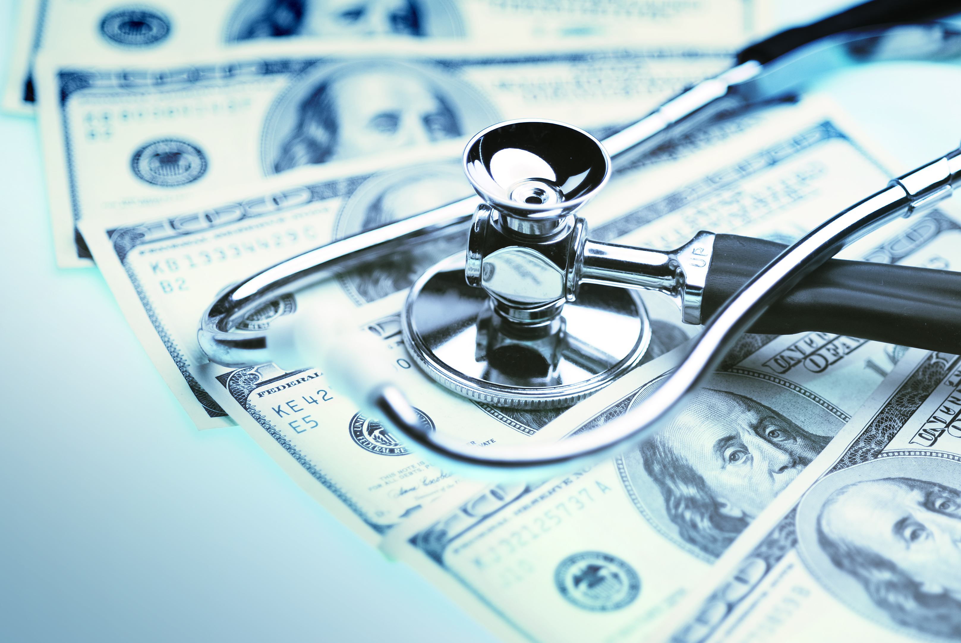 Button to take you to the MCHD Pricing transparency system consisting of a photo of a stethoscope on cash