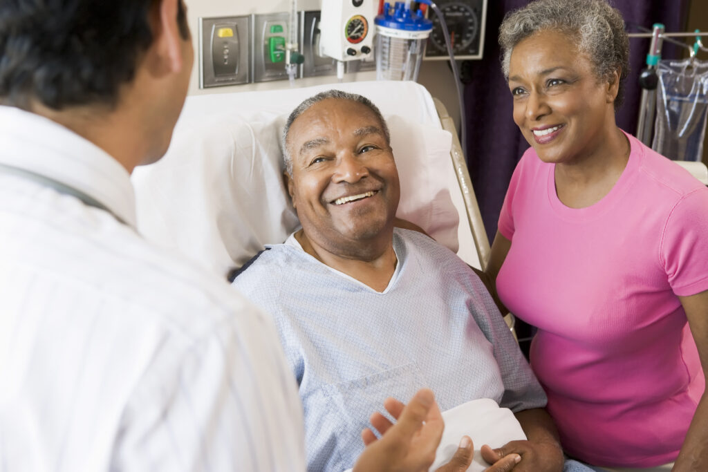 A photo of a senior couple talking with a doctor