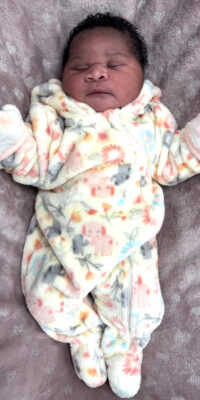 A photograph of a newborn baby