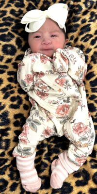 A photograph of a newborn baby