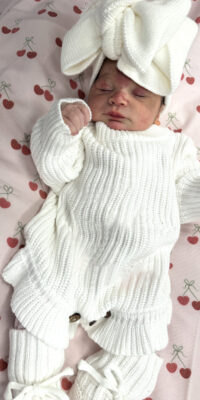 A photograph of a newborn baby