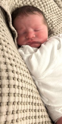 A photograph of a newborn baby