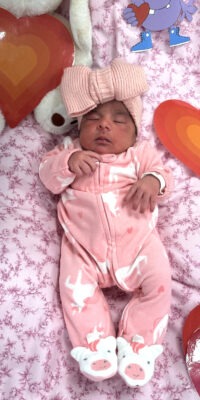 A photograph of a newborn baby