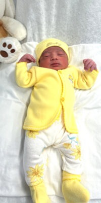 A photograph of a newborn baby