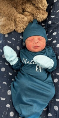 A photograph of a newborn baby