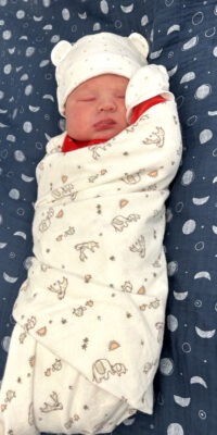 A photograph of a newborn baby