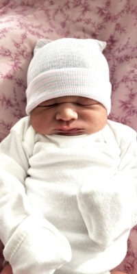 A photograph of a newborn baby