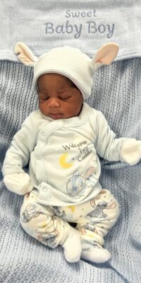 A photograph of a newborn baby