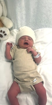 A photograph of a newborn baby