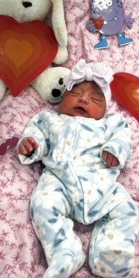 A photograph of a newborn baby