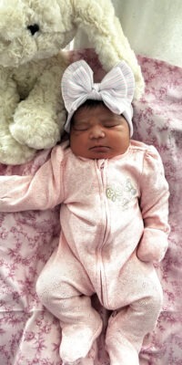 A photograph of a newborn baby