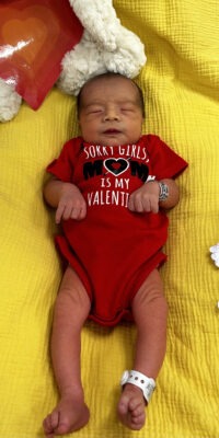 A photograph of a newborn baby