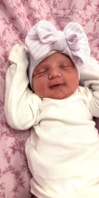 A photograph of a newborn baby