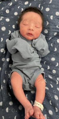 A photograph of a newborn baby