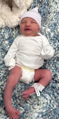 A photograph of a newborn baby