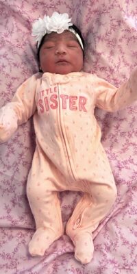 A photograph of a newborn baby