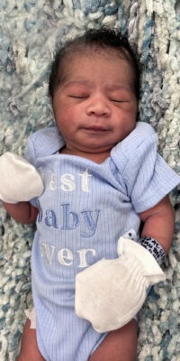 A photograph of a newborn baby