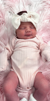 A photograph of a newborn baby