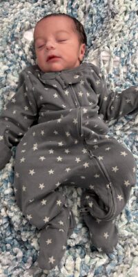 A photograph of a newborn baby