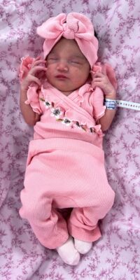 A photograph of a newborn baby