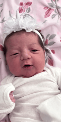 A photograph of a newborn baby