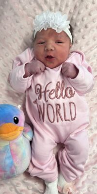 A photograph of a newborn baby