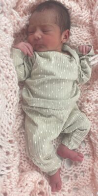 A photograph of a newborn baby