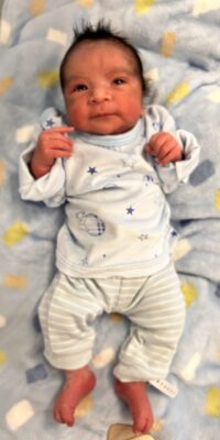 A photograph of a newborn baby