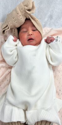 A photograph of a newborn baby