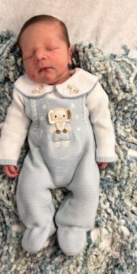 A photograph of a newborn baby