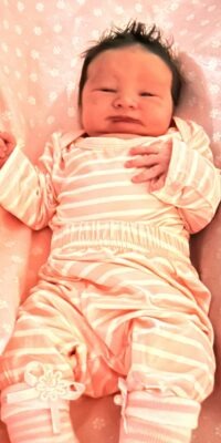 A photograph of a newborn baby