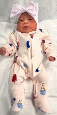 A photograph of a newborn baby