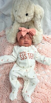 A photograph of a newborn baby