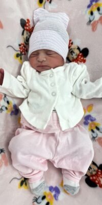 A photograph of a newborn baby