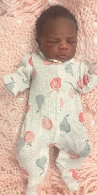 A photograph of a newborn baby