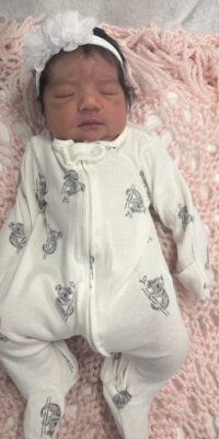 A photograph of a newborn baby