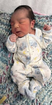 A photograph of a newborn baby