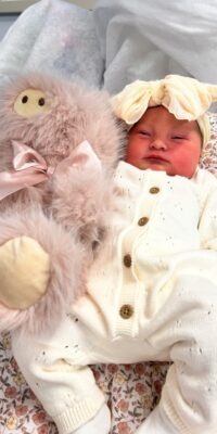A photograph of a newborn baby