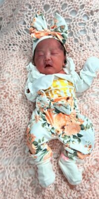 A photograph of a newborn baby